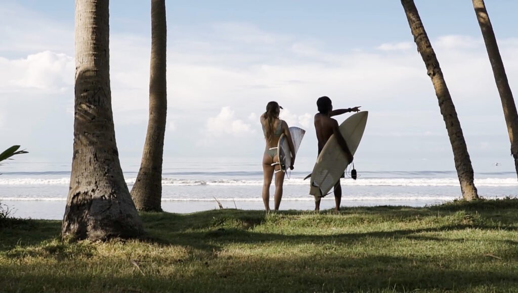Two surfers on a Bali beach