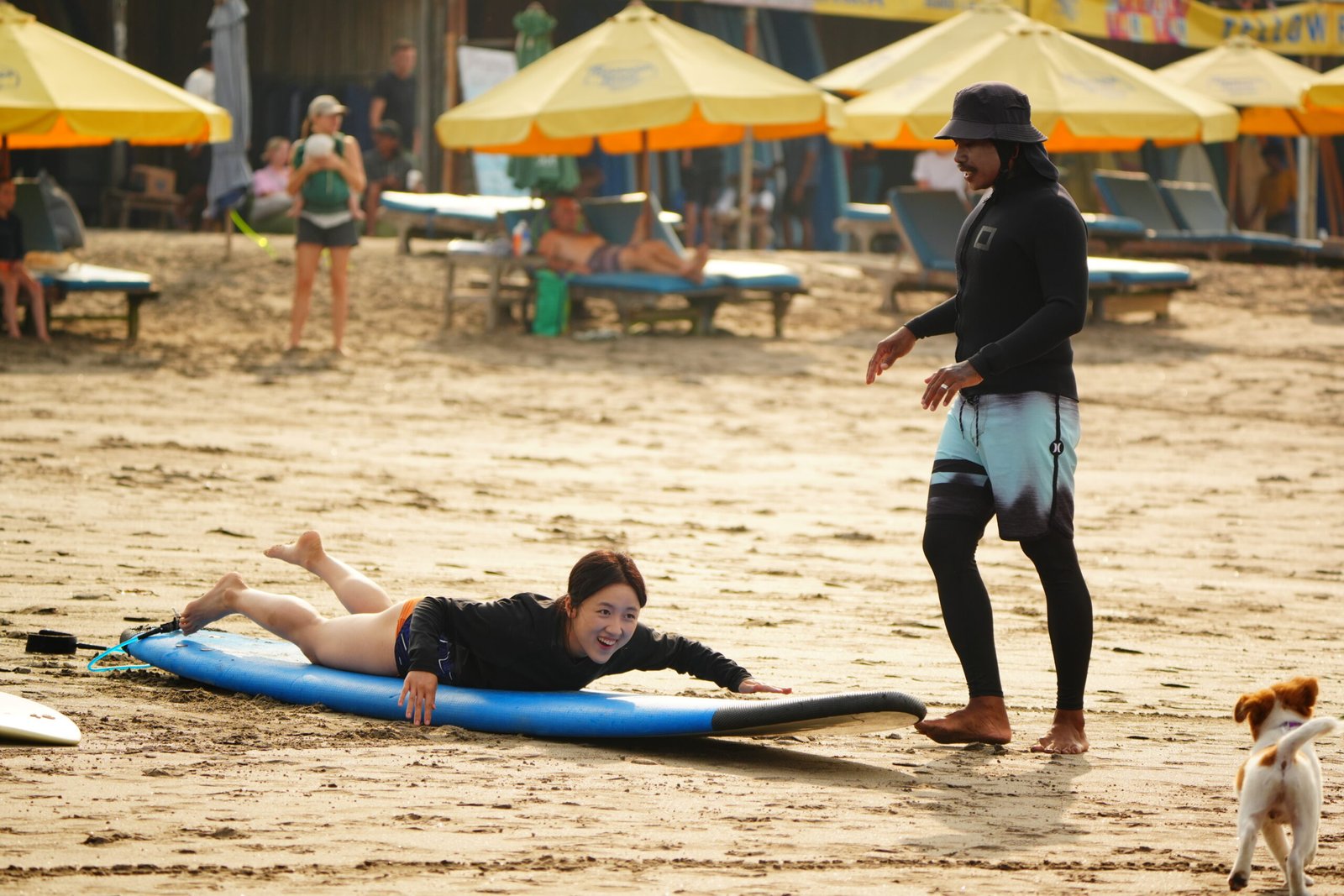 Made Moks and a guest laughing on the beach